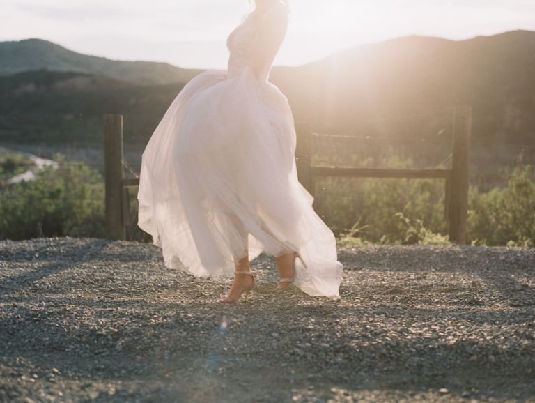 Bride running in her gown