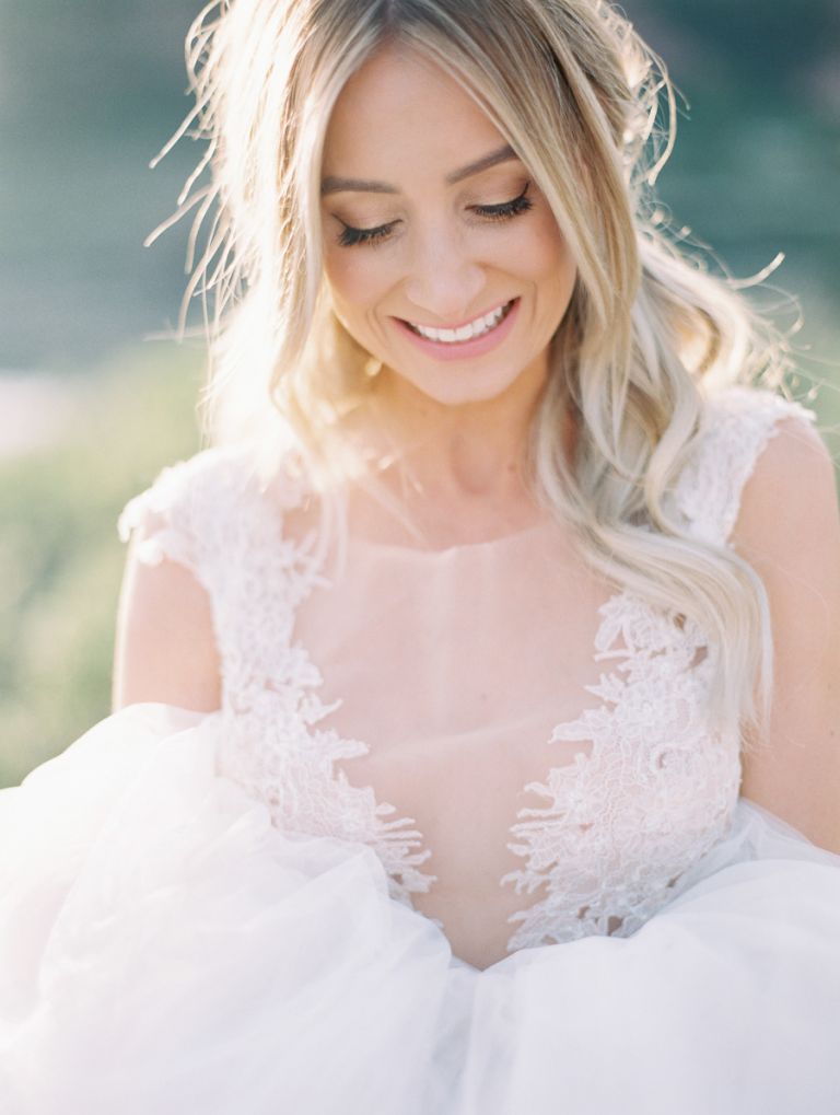 Smiling bride with a tulle wedding gown 